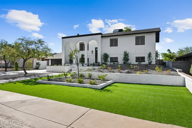a swimming pool with outdoor seating and yard