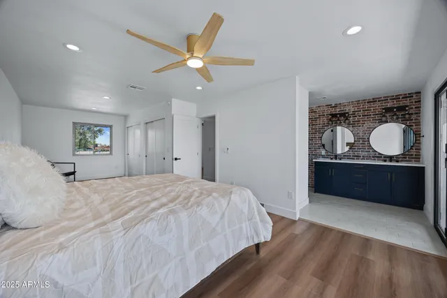 a bedroom with a bed and a dresser