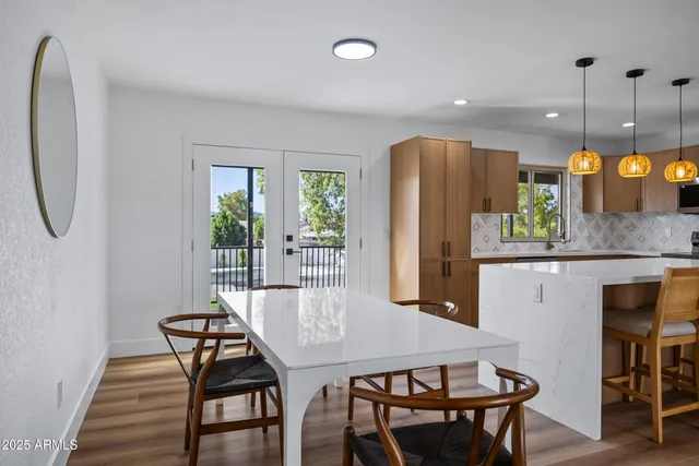 a dining room with furniture and window