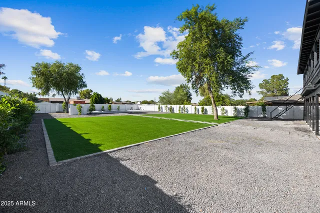 a view of outdoor space with garden and green space