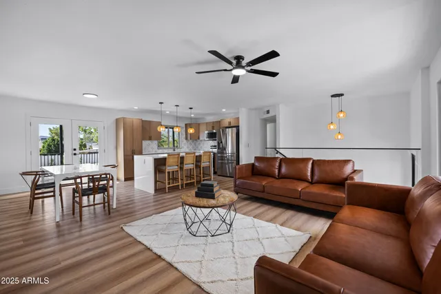 a view of green field with a house in the background