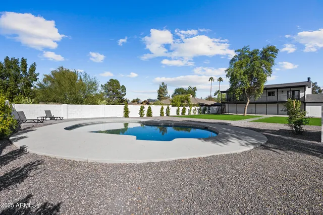 a view of swimming pool with a balcony