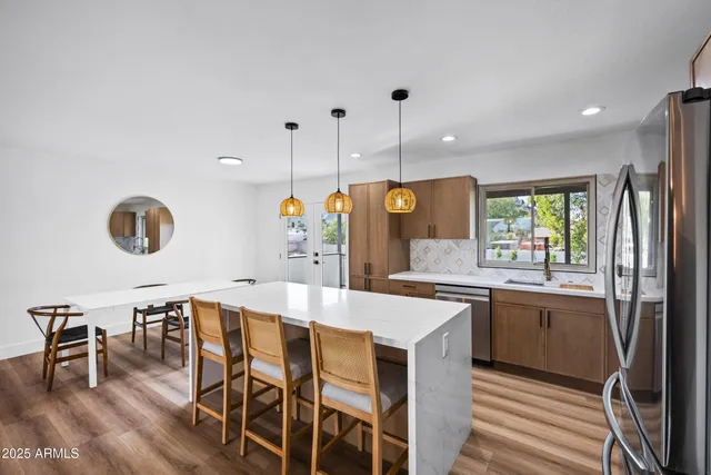 a kitchen with a table and chairs in it