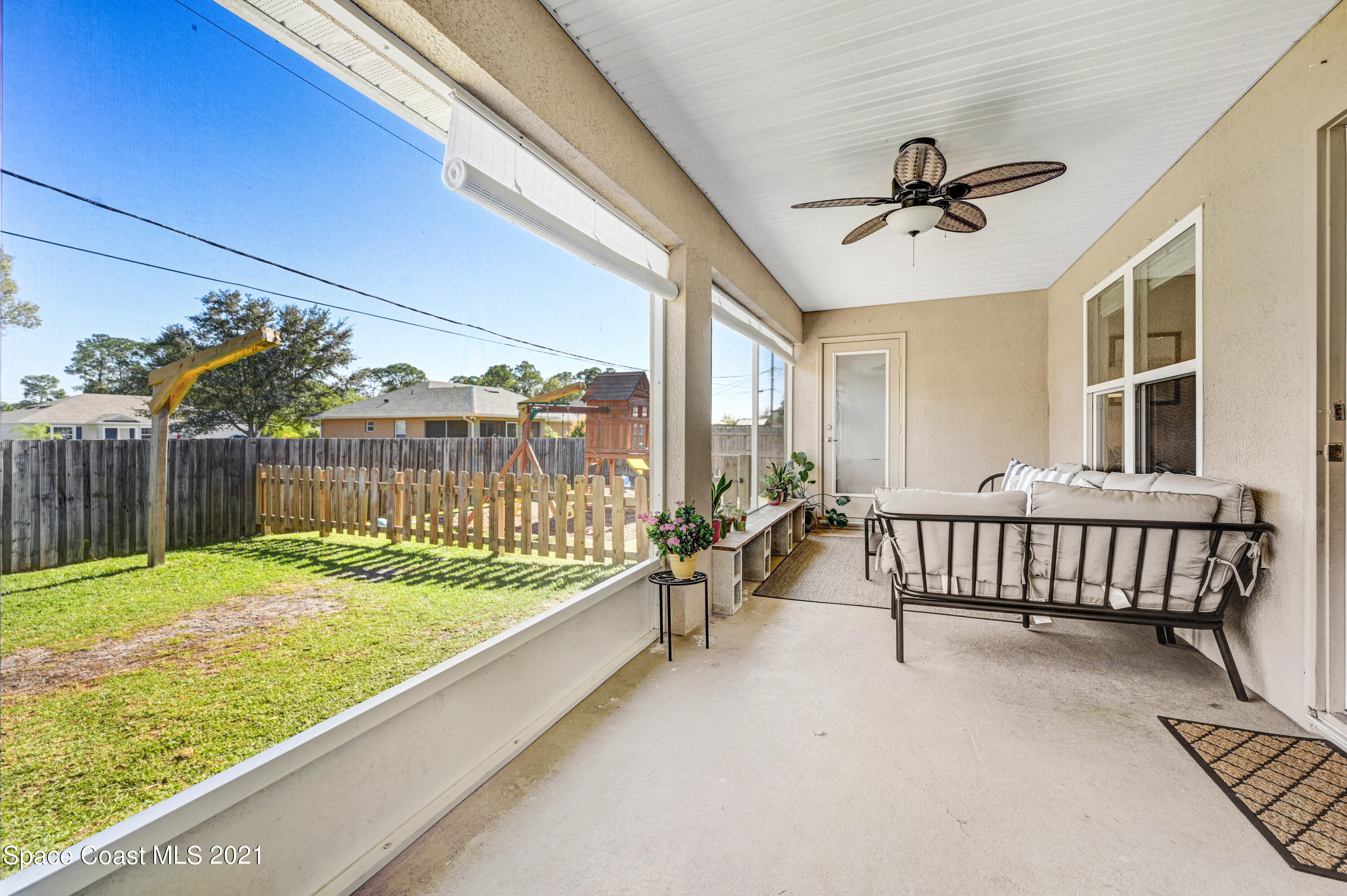 737 Atlantis Road Southeast Palm Bay, FL 32909 - Photo 22 of 29 a view of a porch with furniture and garden