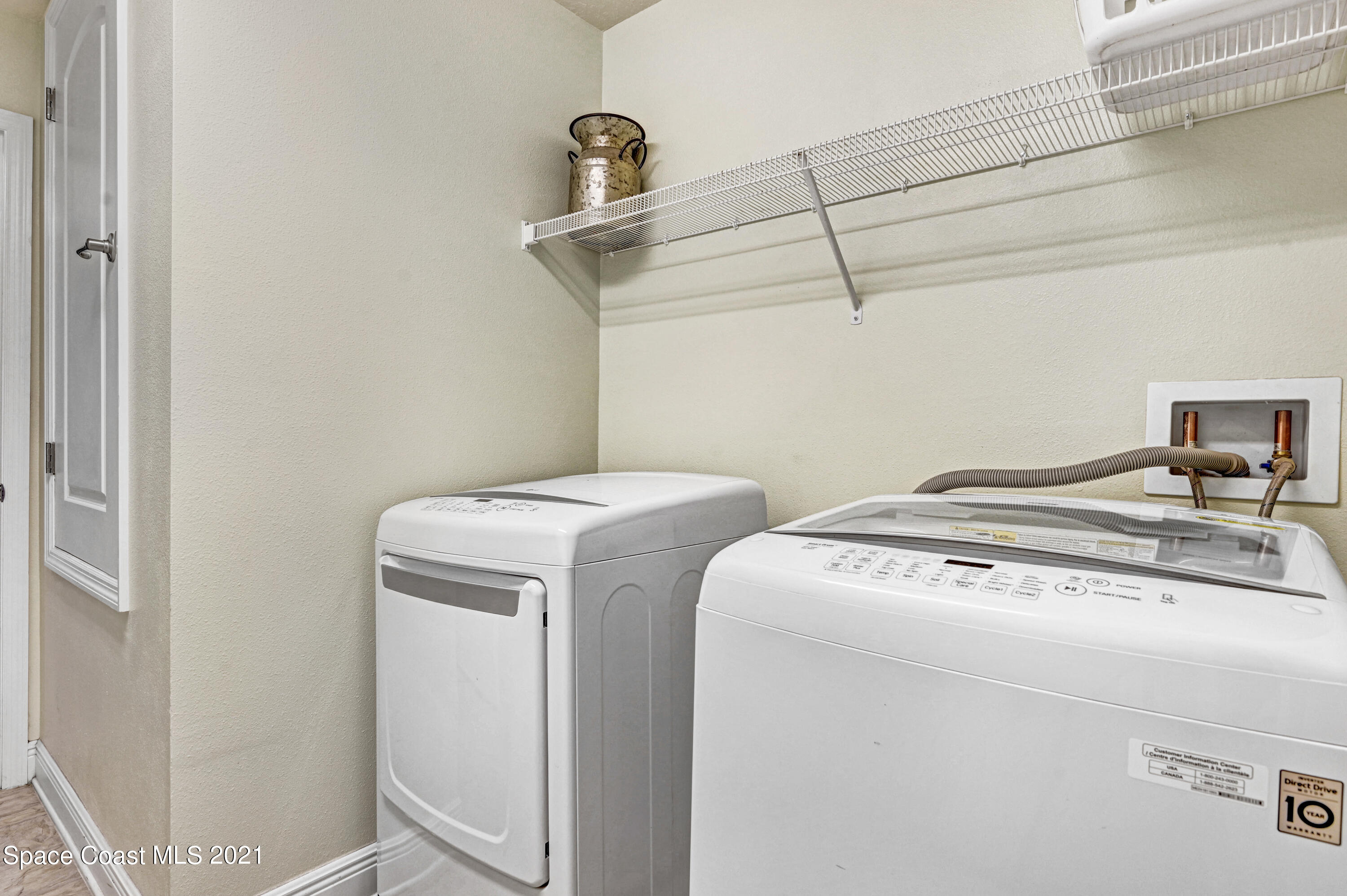 737 Atlantis Road Southeast Palm Bay, FL 32909 - Photo 26 of 29 a utility room with dryer and washer