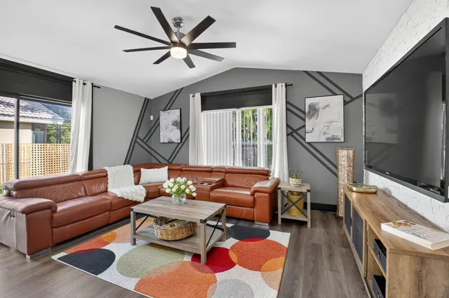 a bathroom with a bathtub a window and a shower