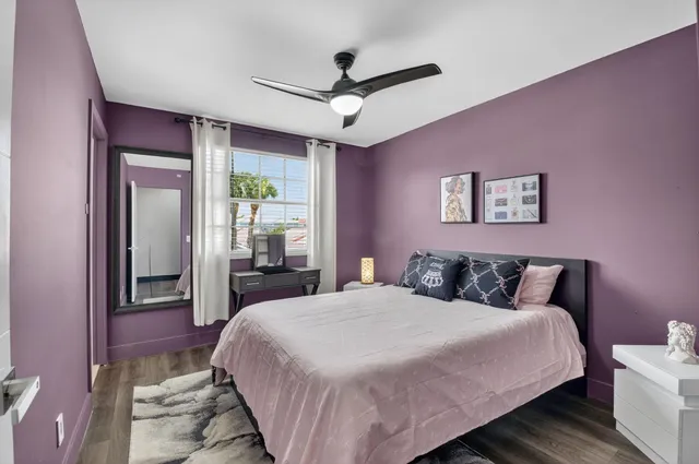 an aerial view of a house with a garden and swimming pool