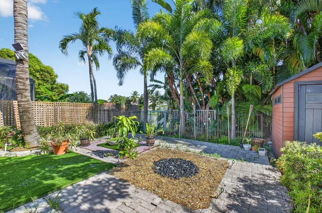 an aerial view of residential houses with outdoor space and street view