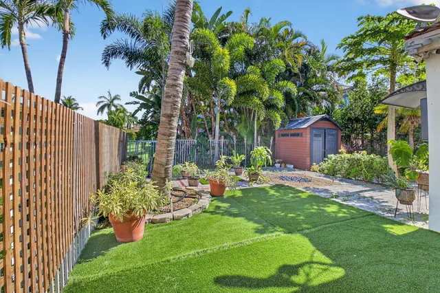a view of a park with iron fence