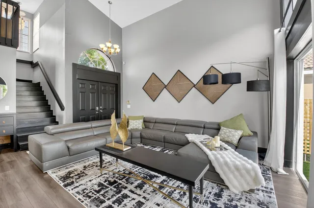 a kitchen with stainless steel appliances kitchen island granite countertop a sink and cabinets