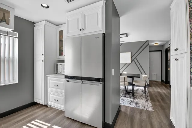 a view of a dining room with furniture and wooden floor