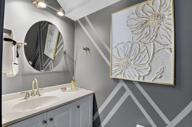 a bedroom with a large bed couch and a window