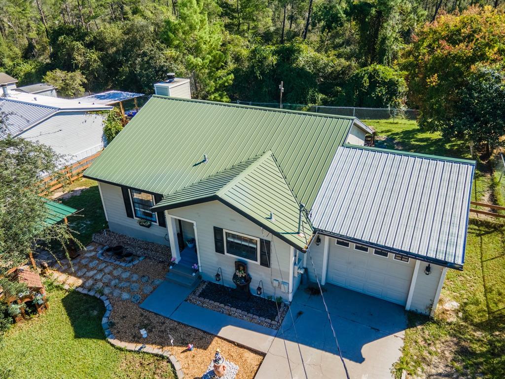 an aerial view of a house having swimming pool