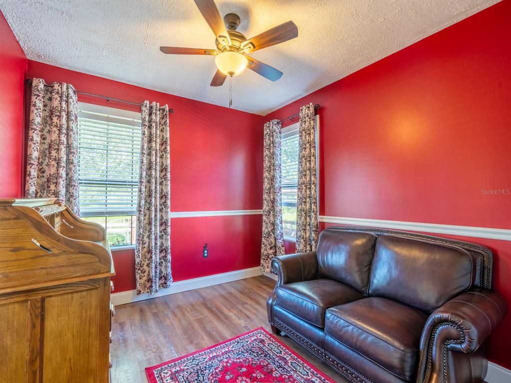 13425 Maple Drive Fort McCoy, FL 32134 - Photo 16 of 41 a living room with furniture and a window