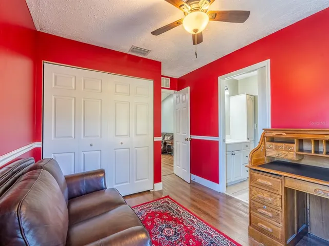 a living room with furniture and a rug