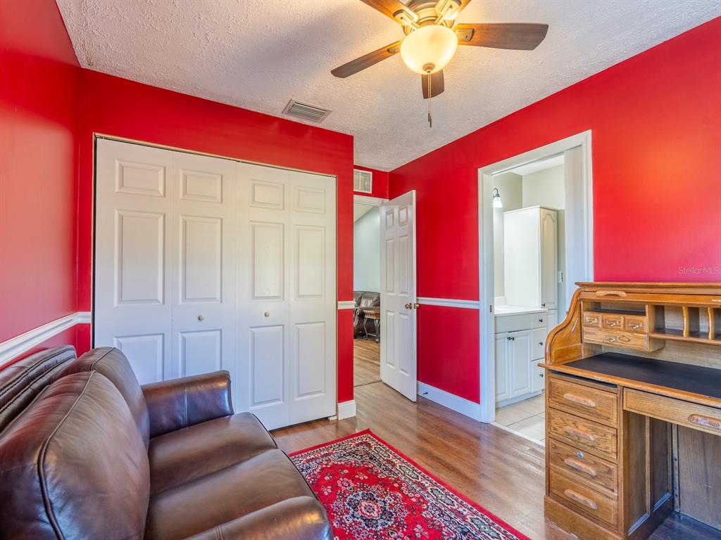 13425 Maple Drive Fort McCoy, FL 32134 - Photo 17 of 41 a living room with furniture and a rug