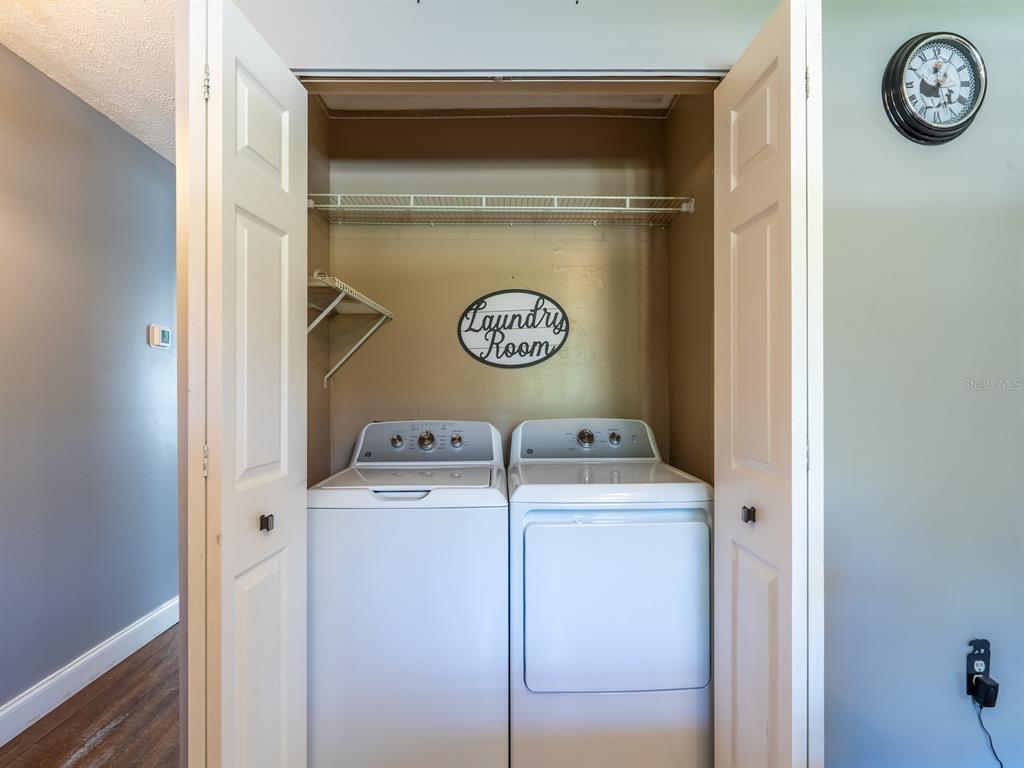 13425 Maple Drive Fort McCoy, FL 32134 - Photo 20 of 41 a utility room with dryer and washer