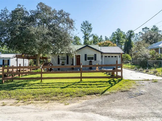 a house with swimming pool in front of it