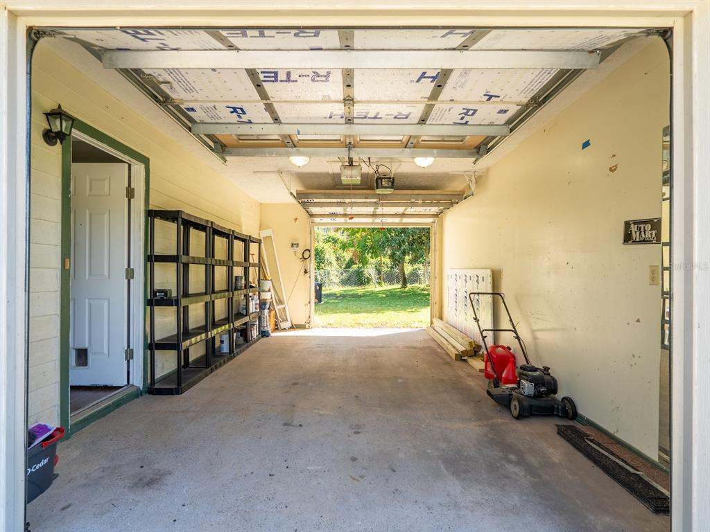 13425 Maple Drive Fort McCoy, FL 32134 - Photo 23 of 41 a view of a room with wooden walls and windows
