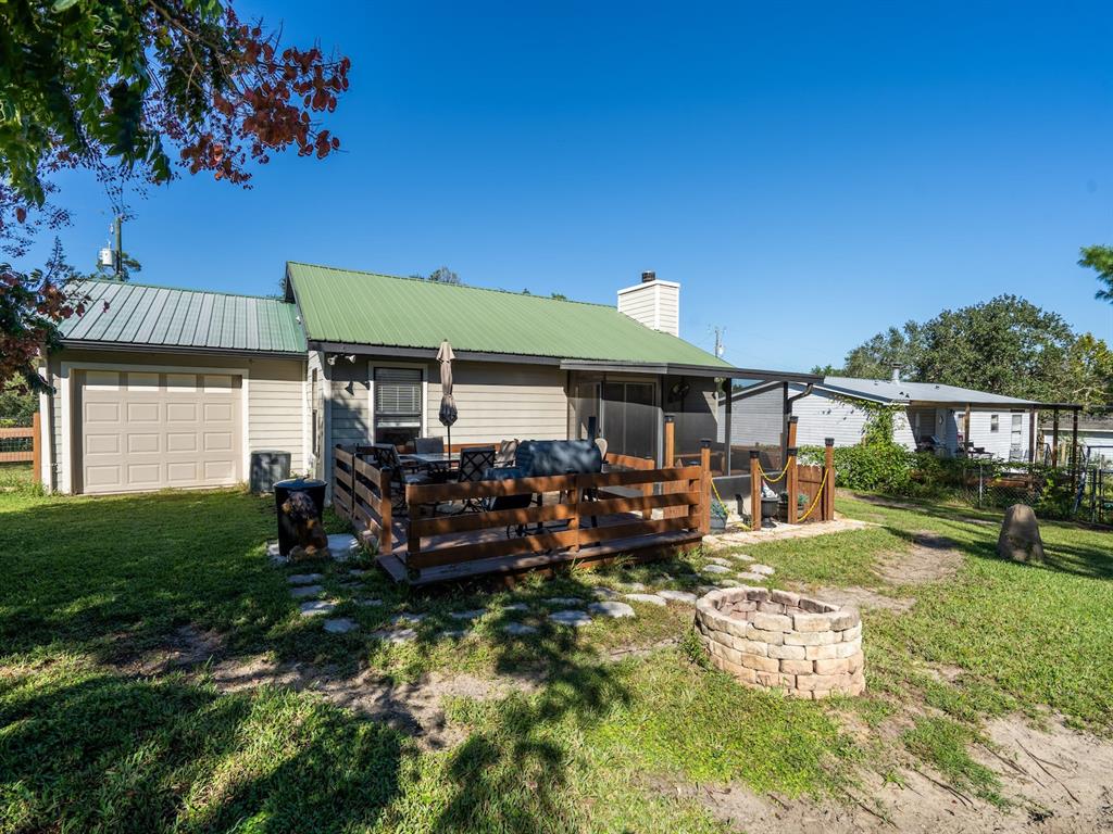 13425 Maple Drive Fort McCoy, FL 32134 - Photo 26 of 41 a view of a house with backyard porch and sitting area