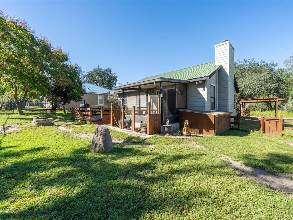 13425 Maple Drive Fort McCoy, FL 32134 - Photo 27 of 41 a front view of a house with a yard
