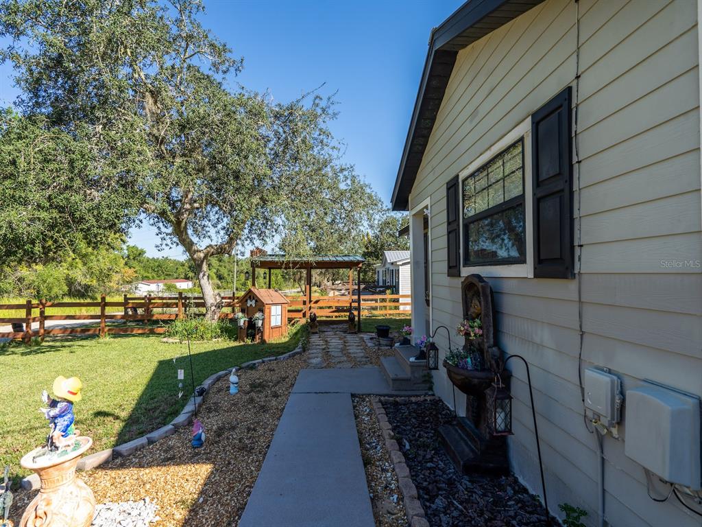 13425 Maple Drive Fort McCoy, FL 32134 - Photo 32 of 41 a view of a backyard with sitting area