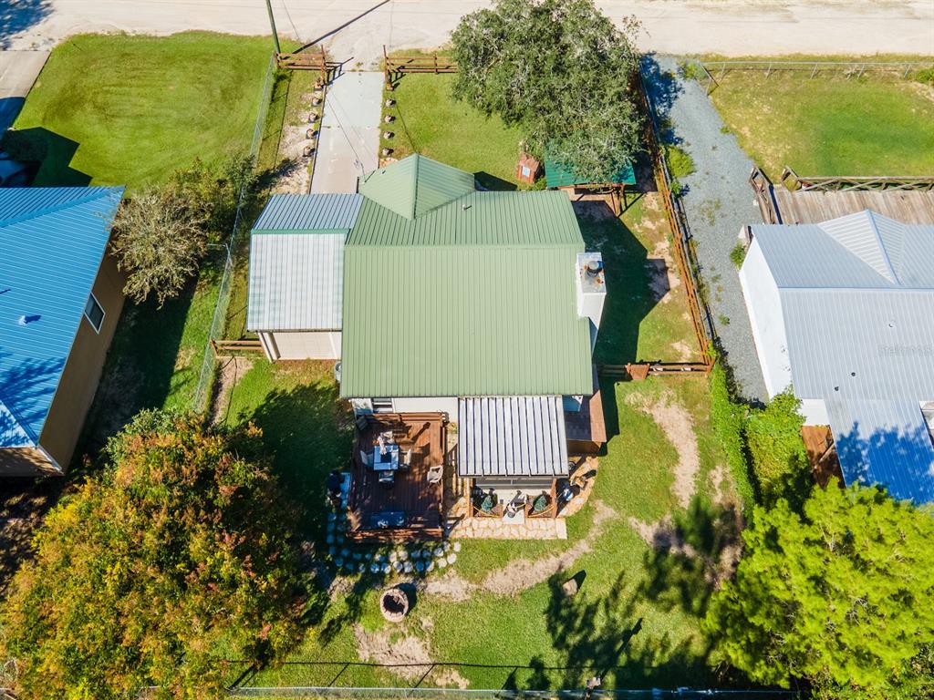 13425 Maple Drive Fort McCoy, FL 32134 - Photo 37 of 41 an aerial view of a house with a yard swimming pool and outdoor seating