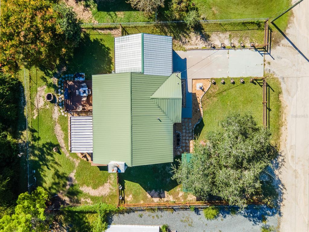 13425 Maple Drive Fort McCoy, FL 32134 - Photo 38 of 41 an aerial view of a house with a yard