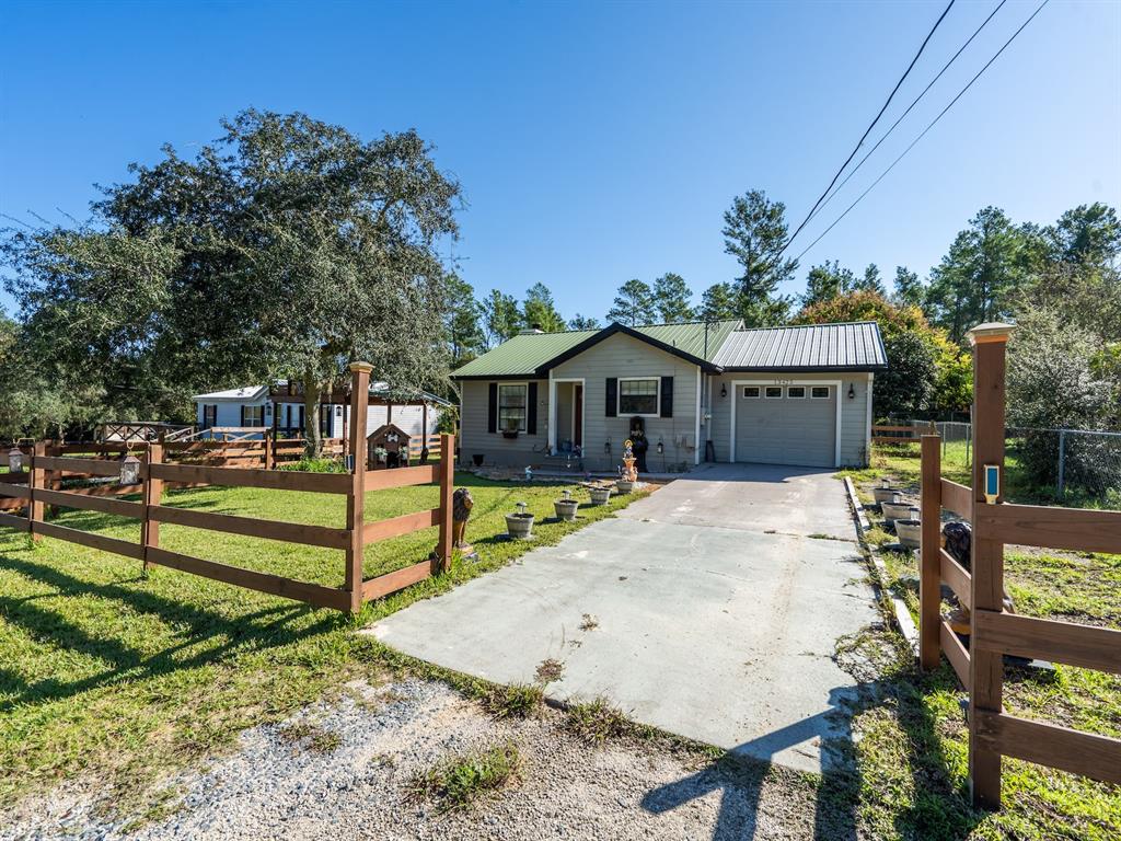 13425 Maple Drive Fort McCoy, FL 32134 - Photo 4 of 41 a view of house with wooden deck and furniture