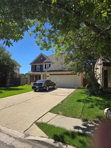 a house with yard in front of it