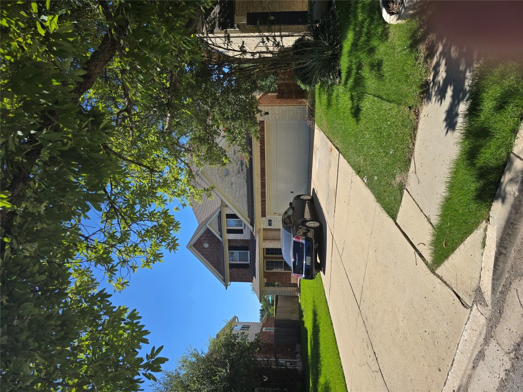 a house with yard in front of it