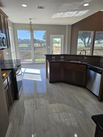 a large bathroom with a large tub and sink