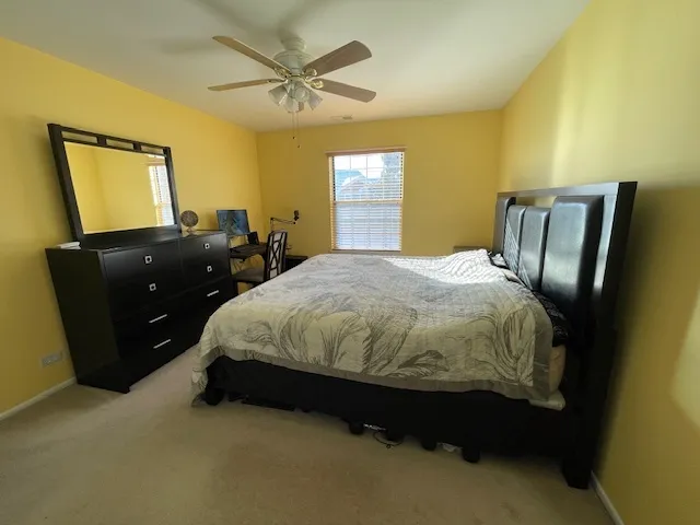 a bedroom with a bed and window