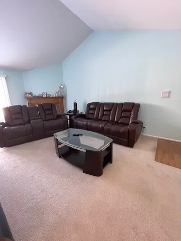 a living room with furniture and a couch