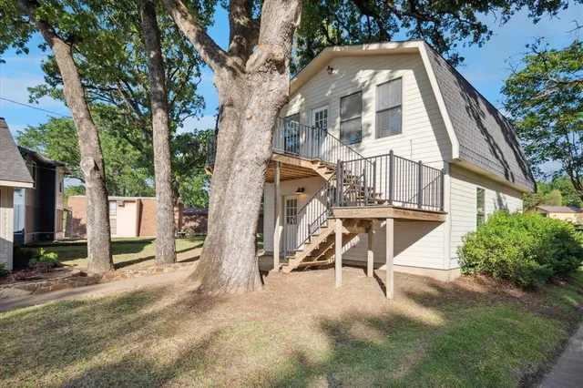 a view of a building with a yard