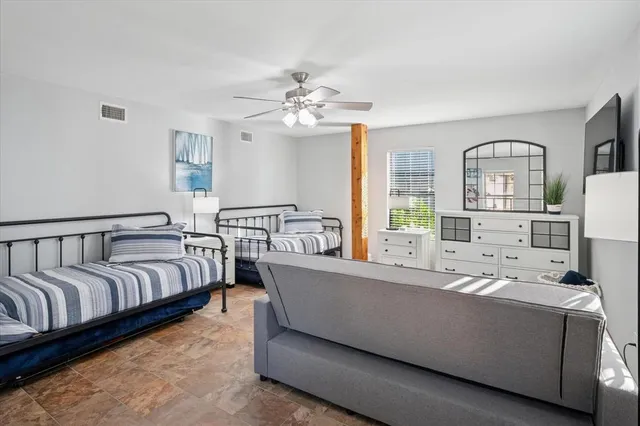 a living room with furniture fireplace and a window
