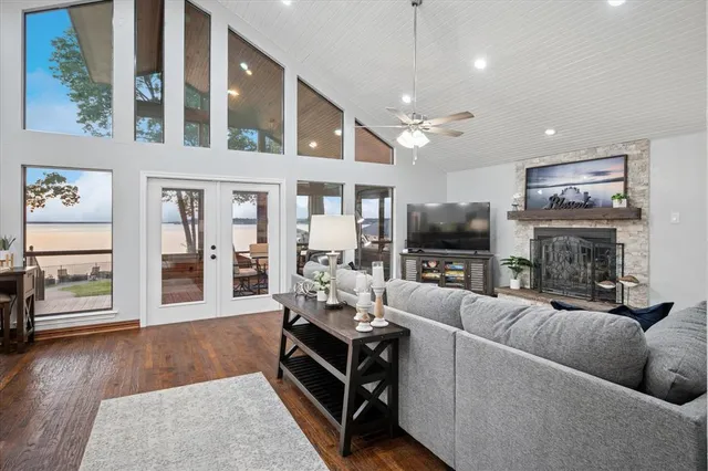 a living room with furniture fireplace and flat screen tv