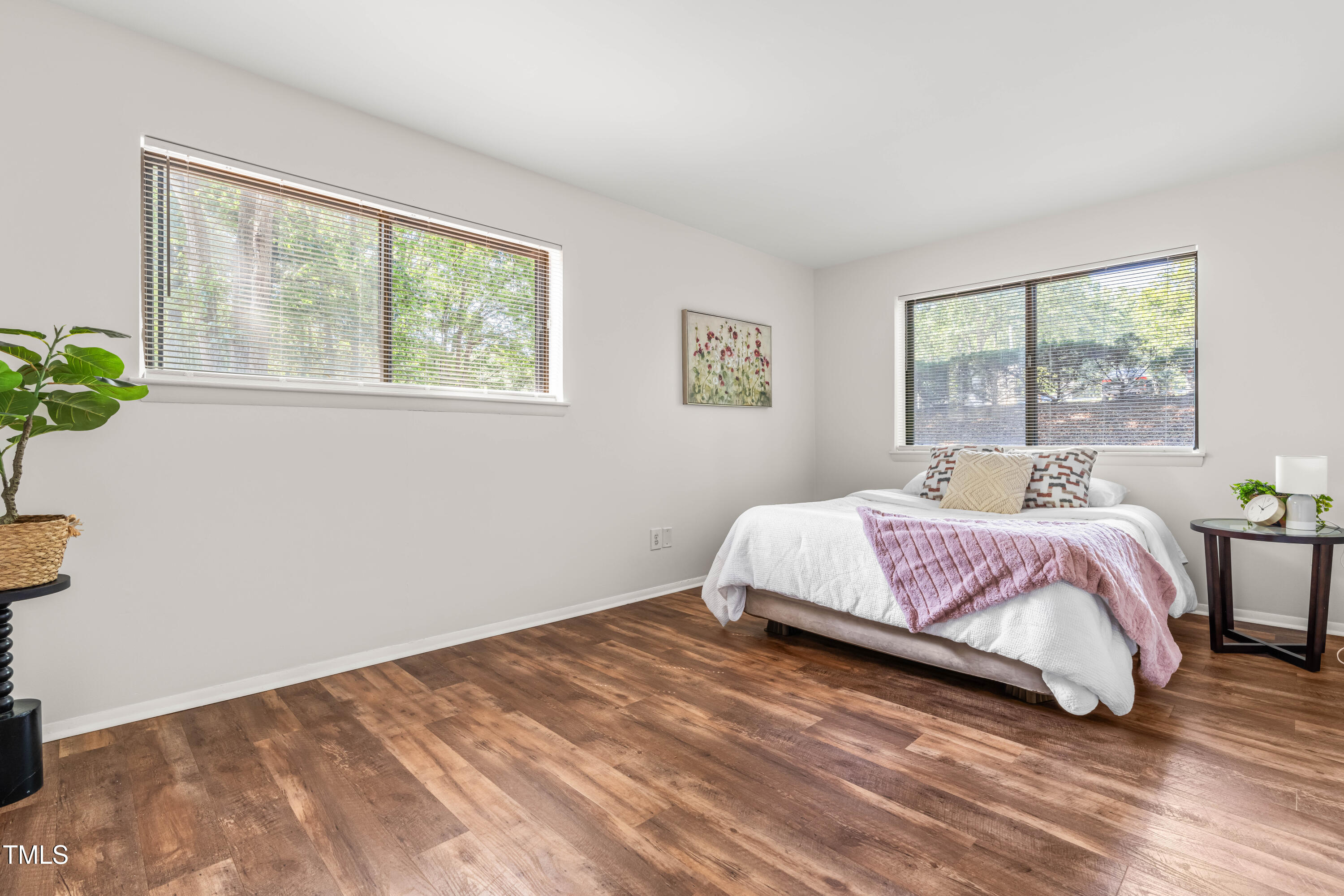1212 Schaub Drive, Unit C Raleigh, NC 27606 - Photo 20 of 23 a bedroom with a bed and a window