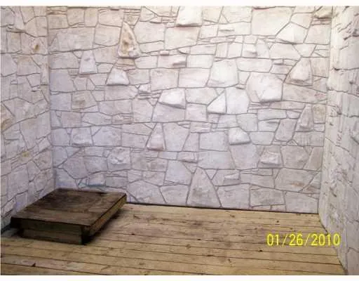 a wooden bench sitting in a backyard