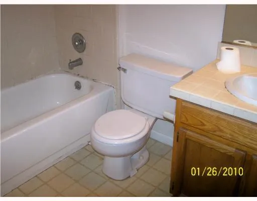 a bathroom with a toilet and a sink