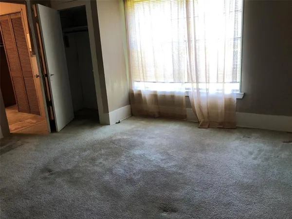 a kitchen with stainless steel appliances granite countertop a stove and a refrigerator
