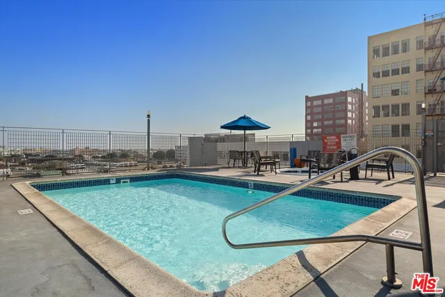a view of a swimming pool with chairs