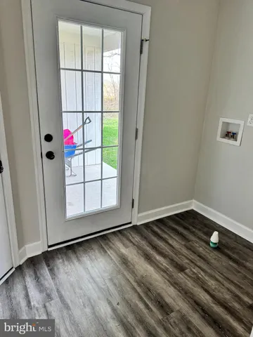 a bathroom with a sink vanity and a toilet
