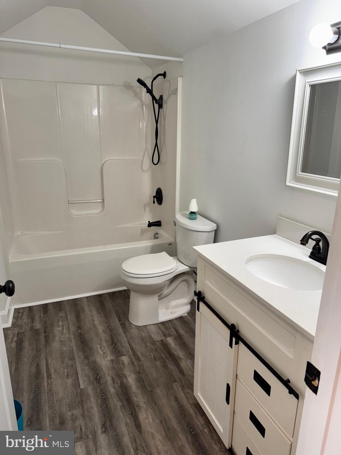 7052 Winchester Avenue Inwood, WV 25428 - Photo 11 of 17 a bathroom with a sink a toilet and shower