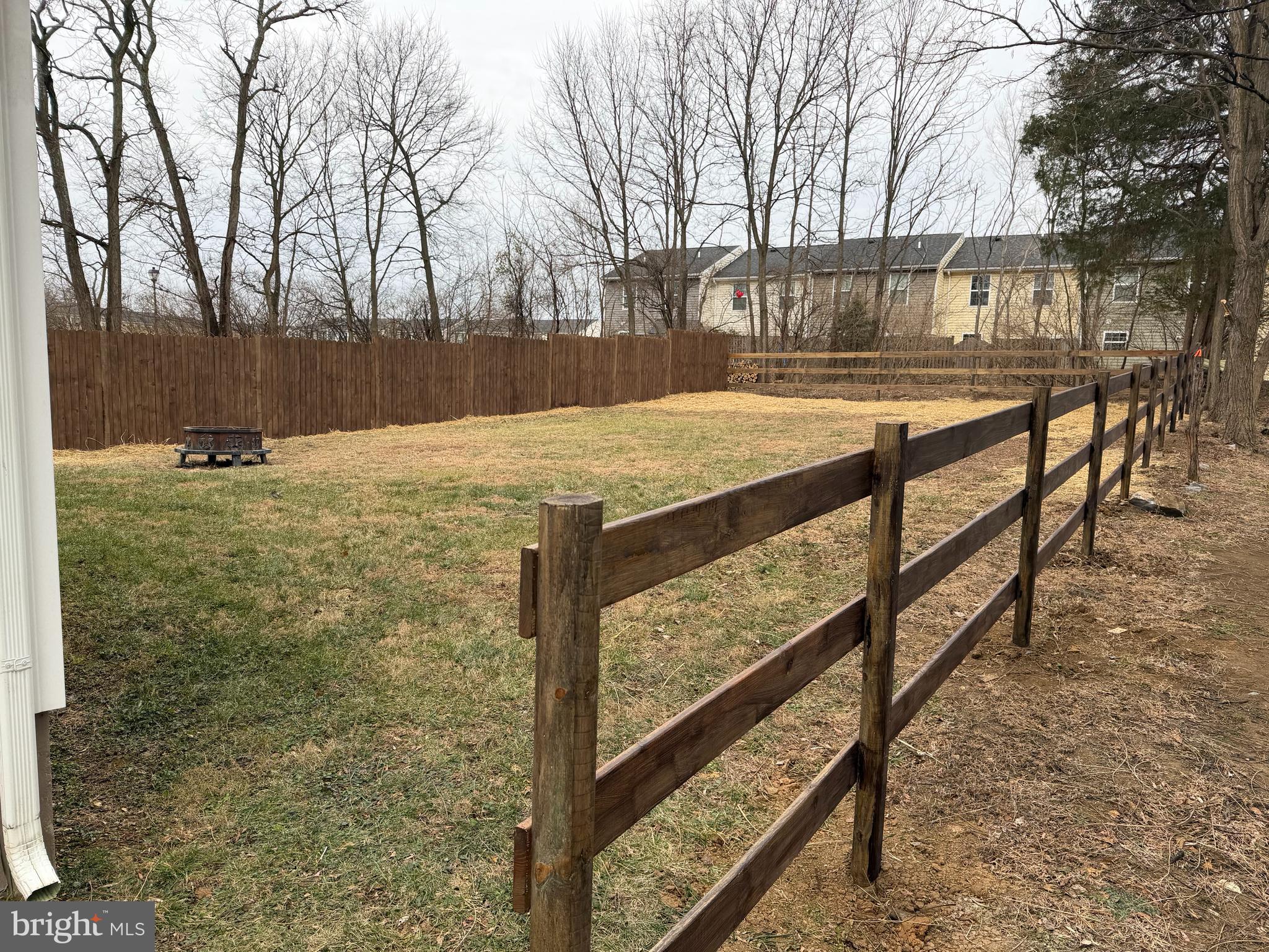 7052 Winchester Avenue Inwood, WV 25428 - Photo 16 of 17 a view of a backyard with wooden fence