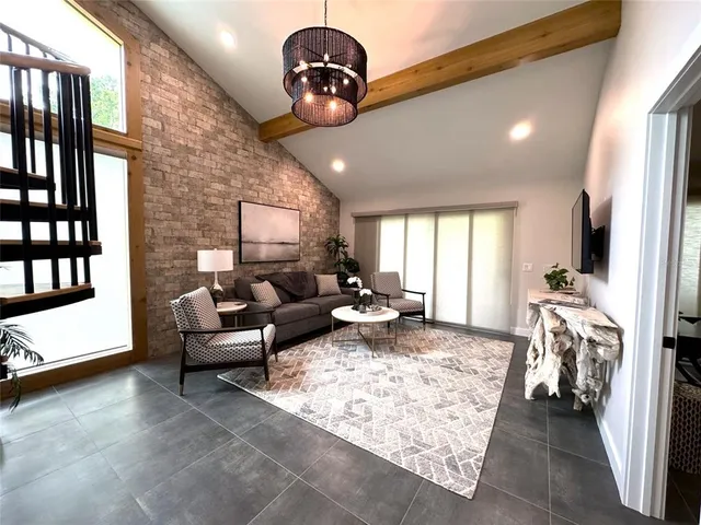 a spacious bathroom with a bathtub a sink and a mirror