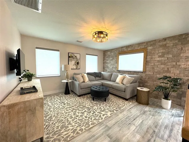 a view of a dining room with furniture and window