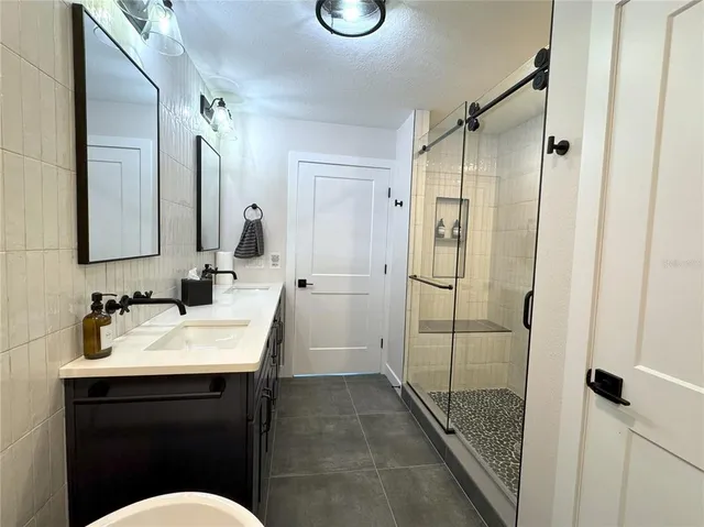 an aerial view of a residential apartment building with swimming pool and outdoor space