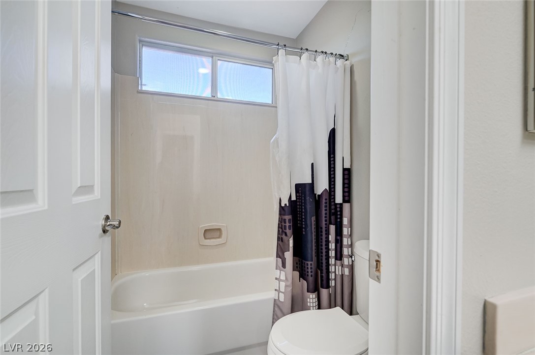 2391 Rainswept Avenue Henderson, NV 89052 - Photo 48 of 62 This clean and inviting bathroom features a convenient tub and toilet.