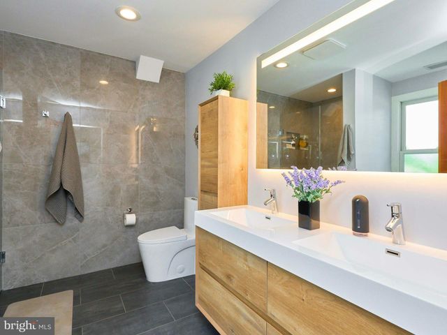 a bathroom with a sink and mirror